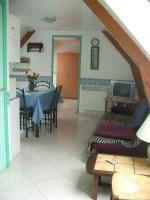 a living room with a couch and a table at APPARTEMENT WISSANT in Wissant