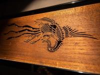 a wooden bench with a dragon etched on it at Tokyu Stay Kyoto Sanjo-Karasuma in Kyoto