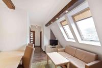Televízia a/alebo spoločenská miestnosť v ubytovaní Apartamenty Sun & Snow Kościelisko Residence