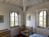 Posteľ alebo postele v izbe v ubytovaní villa montalcino palazzina castelverdelli