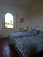 Posteľ alebo postele v izbe v ubytovaní villa montalcino palazzina castelverdelli