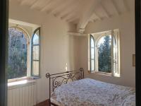 Posteľ alebo postele v izbe v ubytovaní villa montalcino palazzina castelverdelli