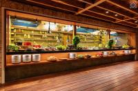 a kitchen with plates and dishes on a counter at Zuri Zanzibar in Kendwa