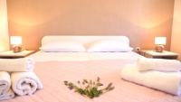 Posteľ alebo postele v izbe v ubytovaní Apartmani Mirela & Feri