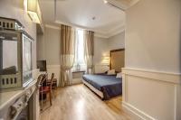 Posteľ alebo postele v izbe v ubytovaní 939 Hotel