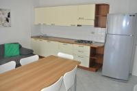 A kitchen or kitchenette at Condominio BILLA