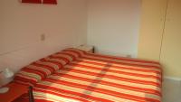 A bed or beds in a room at Condominio BILLA