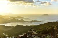 a view of the ocean with mountains in the distance at TopHome 9 in Jiufen