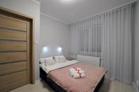 Posteľ alebo postele v izbe v ubytovaní Dream Apartment