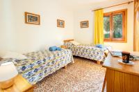 Postel nebo postele na pokoji v ubytování Chalet Joan i Nuria By homevillas360