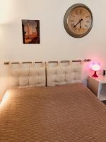 A bed or beds in a room at La Dolce Vita studio with free private parking