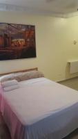 Postel nebo postele na pokoji v ubytování TERRAZAS DEL CARIBE, APARTA HOTEL.