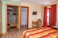 Łóżko lub łóżka w pokoju w obiekcie Hotel Chaberton