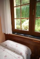 A bed or beds in a room at Hotel Garganta del Cares