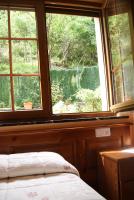 A bed or beds in a room at Hotel Garganta del Cares