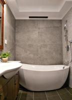 a bathroom with a tub and a sink at Beauty Hotels - Star Beauty Resort in Taipei