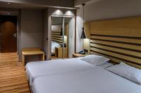 Posteľ alebo postele v izbe v ubytovaní Agamemnon Hotel