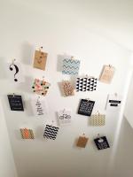 a wall with many magnets on a white wall at Flat on 2 floors near stade de france in Aubervilliers