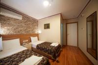 A bed or beds in a room at Hotel Akcinar