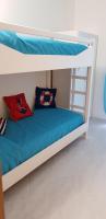 Łóżko lub łóżka w pokoju w obiekcie Petra Marina Home