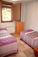 A bed or beds in a room at Apartamento Angel e Isabel