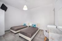Postel nebo postele na pokoji v ubytování Villa Kavallaris & Apartments