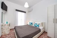 Postel nebo postele na pokoji v ubytování Villa Kavallaris & Apartments
