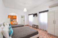 Postel nebo postele na pokoji v ubytování Villa Kavallaris & Apartments