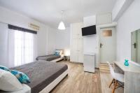 Postel nebo postele na pokoji v ubytování Villa Kavallaris & Apartments