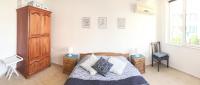 A bed or beds in a room at Apartament Rose