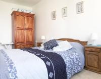 A bed or beds in a room at Apartament Rose