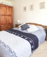 A bed or beds in a room at Apartament Rose