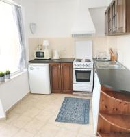 A kitchen or kitchenette at Apartament Rose