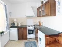 A kitchen or kitchenette at Apartament Rose