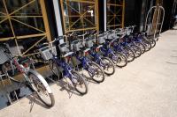 a row of bikes parked in front of a building at Kindness Hotel-Qixian in Kaohsiung