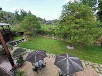 an overhead view of a garden with two people with umbrellas at Sitou Peach Villa B&amp;B in Lugu Lake