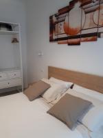 A bed or beds in a room at SoleLuna Fiera 6 Rooms