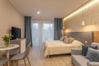 Posteľ alebo postele v izbe v ubytovaní Ambria Apartments Dune