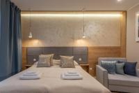 Posteľ alebo postele v izbe v ubytovaní Ambria Apartments Dune