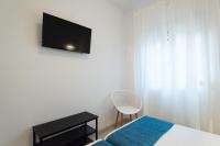 Televízia a/alebo spoločenská miestnosť v ubytovaní Nuevo centro 3 hab 2 baños ac wifi