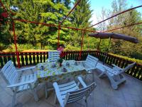 a table and chairs on a patio at Kuća za odmor &quot;Livadica&quot; in Netretić