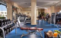 a gym with cardio equipment in a hotel at Charmillion Gardens Aquapark in Sharm El Sheikh