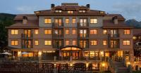 a large building with lights on in front of it at Inn at Lost Creek in Telluride