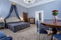 a bedroom with a bed and a table with a vase on it at Hotel Mezzo Pozzo in Venice