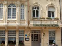 a hotel with a sign on the front of a building at Hotel Manitoba in Blankenberge