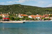 a town on the shore of a body of water at Apartmani Stjepan in Vinišće