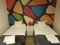 A bed or beds in a room at Apartamentos Sueños de Toledo