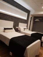 Posteľ alebo postele v izbe v ubytovaní Hotel Malecon