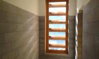 a bathroom with a window in a shower at Hotelski in Verbier