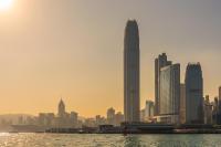 a view of a city with skyscrapers and the water at Four Seasons Hotel Hong Kong in Hong Kong